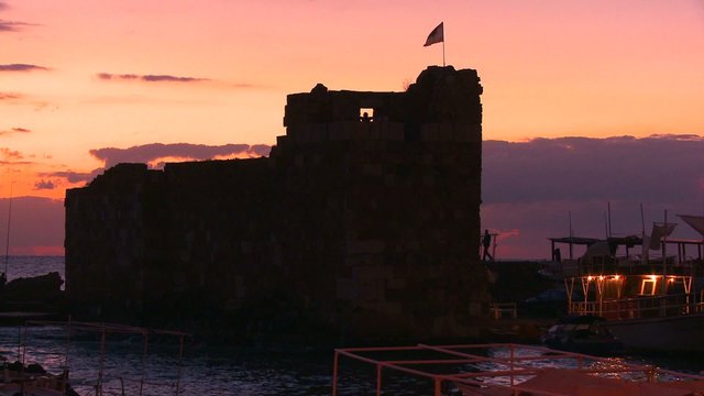 An ancient Phoenician fort guards the entrance to the beautiful and historic fishing village of Byblos on the coast of Lebanon.