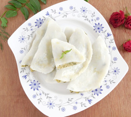 Traditional vegetarian dish made from rice flour dough with spicy filling.