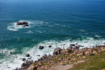 view from the cliff to the stones and ocean