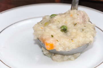 Serving rise risotto with the ladle
