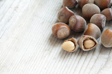 hazelnuts on wooden background