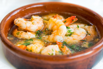 Gambas Pil Pil (Sizzling prawns with chili and garlic). Traditional Spanish tapas dish. - 91749815