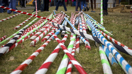 colouful striped poles on the ground