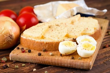 Quail eggs and bread with butter and cheese