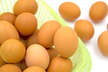 Eggs in basket isolated on white background.Selective focus