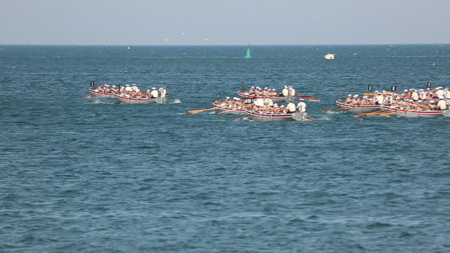 competition teams of sailors on boats 