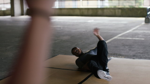4K Male breakdancer dancing whilst being recorded on a smart phone, shot on Red Epic Dragon