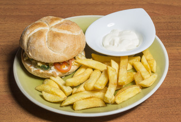 Veggie burger and french fries on plate