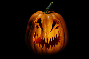 Scary Halloween pumpkin, isolated on black