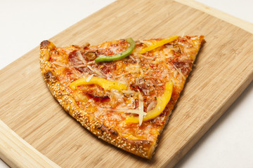 Tasty pizza on wooden board