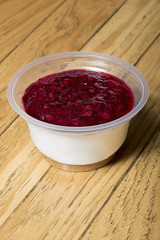 Raspberry cheese cake in plastic cup for take-out