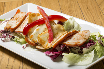 Fried ham and cheese with salad