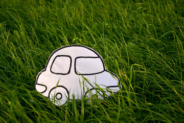 Obraz premium Coloring book car in a green grass