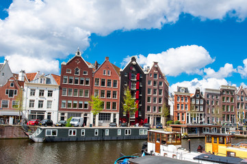 Tipical Amsterdam cityscape with apartment houses in down town. The Kingdom of the Netherlands.