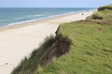 Fototapeta na wymiar Dunes, beach and North Sea near Lokken, Denmark, Europe.