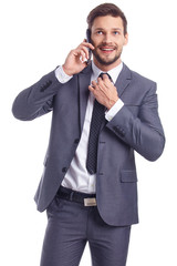 Cool businessman talking on mobile phone
