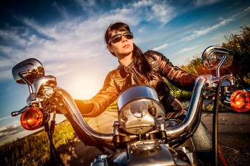 Naklejka premium Biker girl on a motorcycle