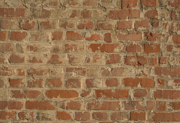 Old red painted brick wall