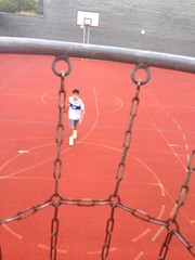 teenage boy playing basketball