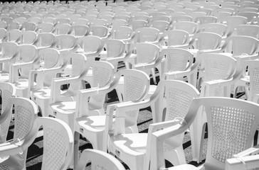 rows of empty chairs at concert
