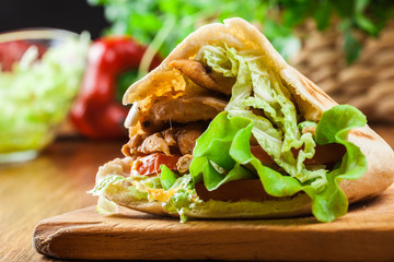 Doner kebab - fried chicken meat with vegetables