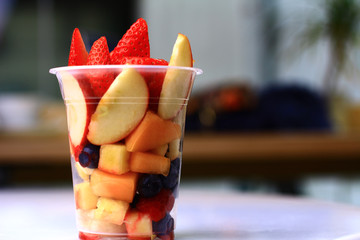 Fruit cup in plastic packaging shot front on with blurred background