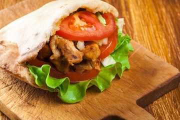 Doner kebab - fried chicken meat with vegetables