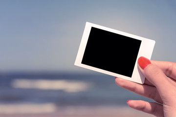 Retro Photo Of Girl Hand Holding Blank Card On Summer Beach