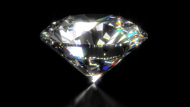 Spinning shining diamond on black background 