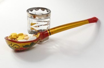 Wooden spoon with pills