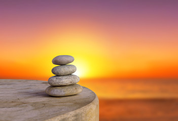 Obraz na płótnie Canvas Balanced several Zen stones on blurred beautiful the beach backg