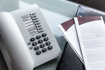 phone, notebook in a hotelroom