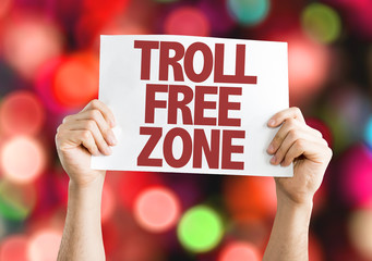 Troll Free Zone placard with bokeh background