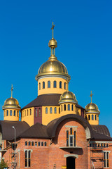 Fototapeta na wymiar Unfinished orthodox church in blue background, Lviv