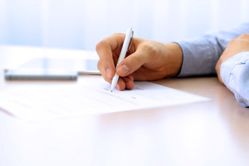 Businessman is signing a contract, business contract details