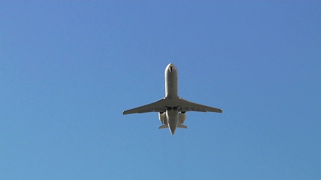 A commercial passenger jet passes overhead. 