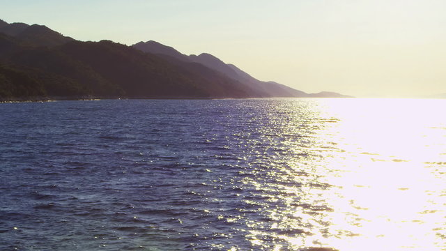 Beautiful Adriatic summer sunset with sun glitter