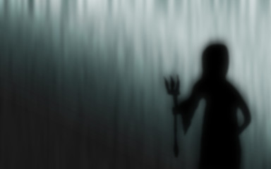 Halloween Grim Reaper silhouettes blur abstract background.