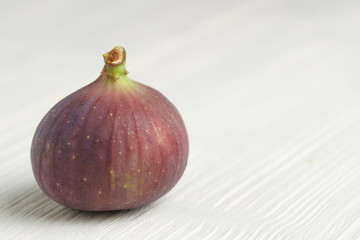 fresh figs on white wooden background