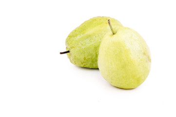 Two Dominican guavas on white background