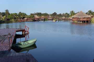 Fototapeta na wymiar Cabins on a Lake Guama Cuba 1