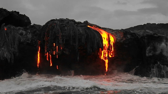 Spectacular dusk lava flow from a volcano into ocean suggest birth of planet.