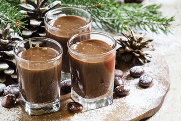Chocolate drink, candy, pine-needles and cones, selective focus