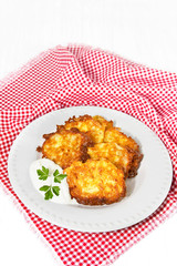 Potato pancakes with sour cream