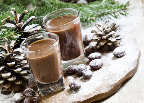 Chocolate drink, candy, pine-needles and cones, selective focus