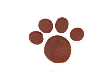 Paw from children bright plasticine - Stock Image macro.