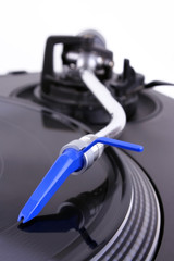 DJ needle on spinning turntable  
