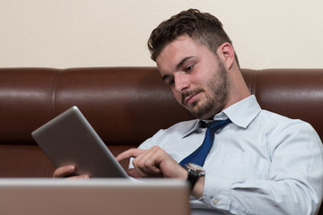 Businessman On A Break With His Computer