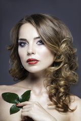 pretty girl's studio portrait with red roses