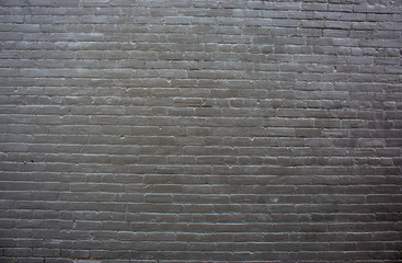 Hintergrund schwarze Backsteinwand mit Fehlstellen